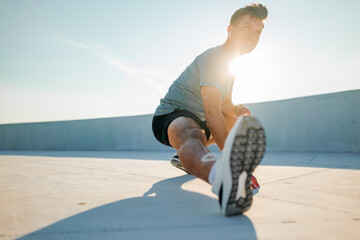Stretching exercises on a sunny day at a rooftop gym to enhance flexibility and fitness