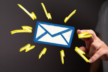 Hand reaching for a glowing email icon. Perfect for communication, inbox, and online marketing...