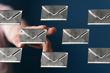 Abstract image of a hand selecting emails.  Perfect for email marketing, communication, and...