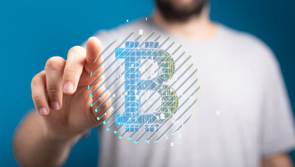 Close-up of a man interacting with a digital Bitcoin symbol, illustrating cryptocurrency technology.
