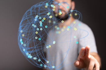 Abstract image of a man interacting with a digital global network. Represents connectivity, data, technology.
