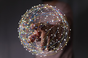 Hand interacts with a digital sphere, representing global connectivity and data networks.