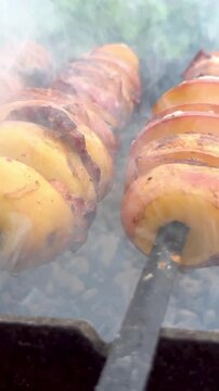 Grilled potatoes with bacon outdoor cooking