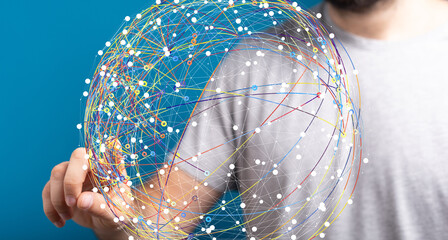 Person interacts with a digital globe, representing global connectivity and network technology.