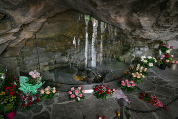 flowers at the Massabielle Grotto in Lourdes, France, Europe