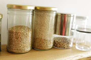 Various grains and rice in glass jars.  Perfect for pantry organization.