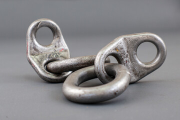 Close up of lifting bracket kit or shackel isolated on grey background. Rigging tool