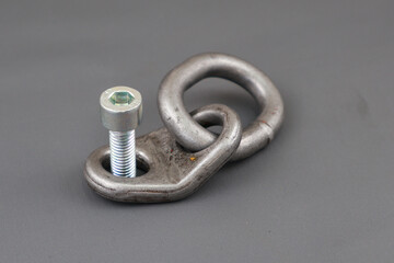 Close up of lifting bracket kit or shackel and bolt isolated on grey background. Rigging tool