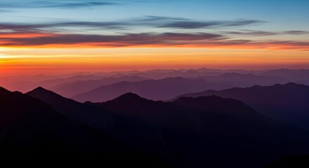 Obraz premium Magnificent alpenglow colors paint mountain ranges at sunrise with beautiful light