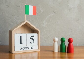 Italian flag and calendar marking august 15th with family figures
