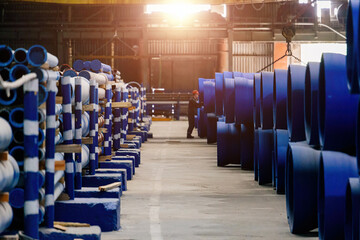 New cast iron pipes for pipeline construction in warehouse, selective focus