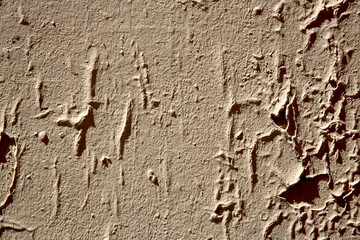 Obraz premium Mur décrépi beige avec décollement de peinture