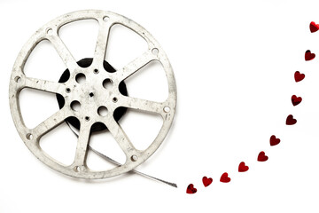 Obraz premium Old 35mm motion picture film reel on white background. Cinema concept
