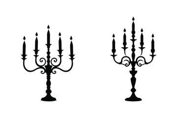 Fototapeta premium Two black silhouette candelabras with five candles each vector illustration