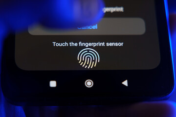 Smartphone screen showing fingerprint sensor prompt for secure access with a finger approaching the scanner.