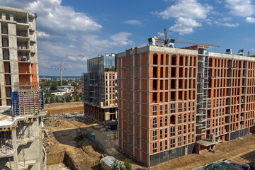 construction site shows multiple high-rise buildings in various stages of development