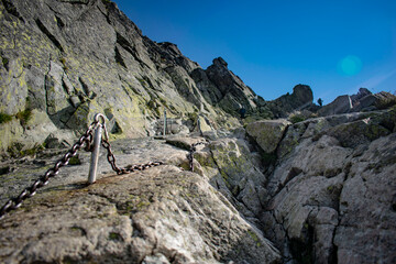 rocky mountain trail with chains
