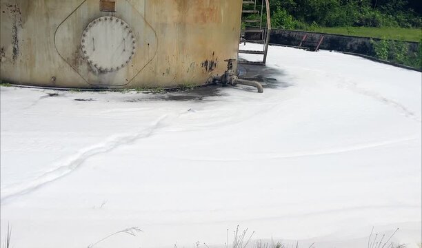 This video shows a pile of Tutogen brand foam after being used in a firefighting exercise using foam spray on a mock oil tank in an open field. Samarinda, Indonesia - July 18, 2025.