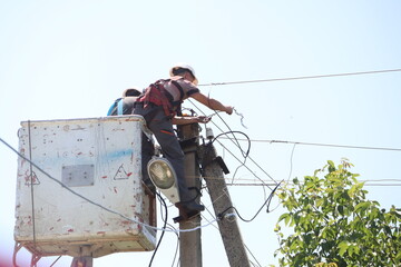 Utility Workers Engaged in the Maintenance and Repair of Power Lines and Infrastructure