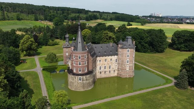 Aerial view of Schloss Merode medieval castle surrounded by greenery in Langerwehe, Germany