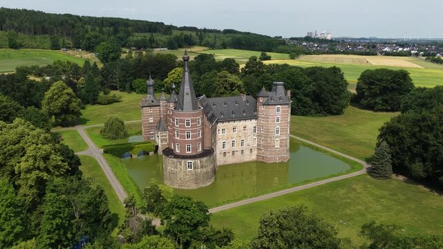 Aerial view of Schloss Merode medieval castle surrounded by greenery in Langerwehe, Germany