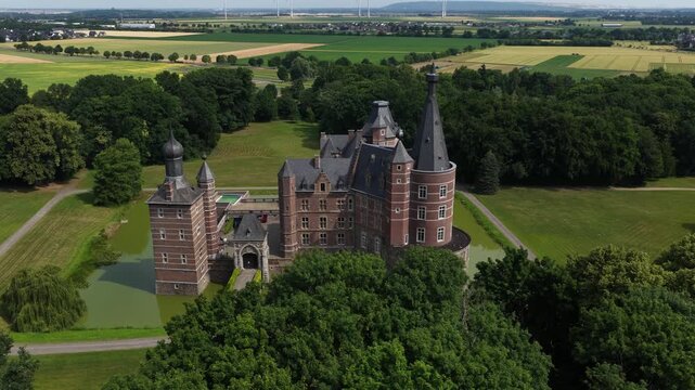 Aerial view of Schloss Merode medieval castle surrounded by greenery in Langerwehe, Germany