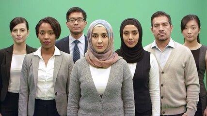 Diverse group of people in business attire against green screen - Powered by Adobe