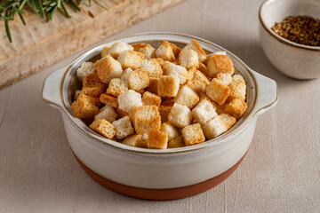 A bowl full of crunchy crostini with a golden, inviting surface, ready to add crunch to any dish....