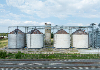 Agro-processing manufacturing plant for processing drying cleaning and storage of agricultural product, grain harvest. Modern silos. grain elevator facility. Large iron terminal of grain