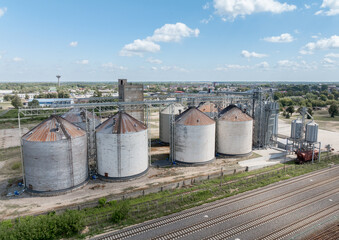 Agro-processing manufacturing plant for processing drying cleaning and storage of agricultural product, grain harvest. Modern silos. grain elevator facility. Large iron terminal of grain
