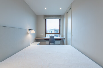 Minimalism Bedroom Interior. Window, Chair and Table in Background.