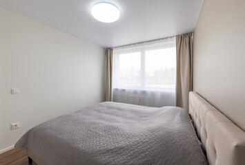 Minimalism Children, Young Adult Living Room Interior. Gray Blanket on the Bed.