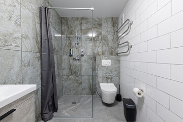Bright Elegant Modern Minimalist Bathroom Interior Design of Shower Room With White Sink. Bathroom Accessories, Gray Tile Walls
