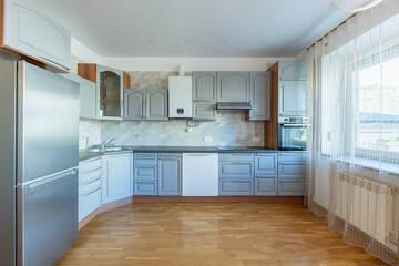 Classic Home Kitchen Interior. Wooden Floor, Oven, Kettle, Gas Heater. Minimalistic Interior Design