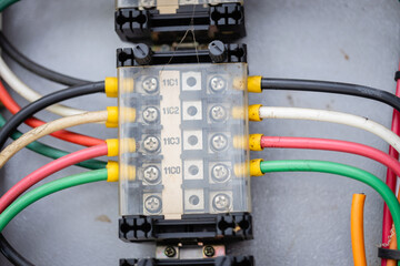 Engineer is working on high voltage power substation performing inspection and check of electrical...