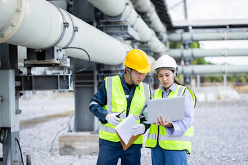 Engineer working at high voltage power substation infrastructure inspection check with safety...
