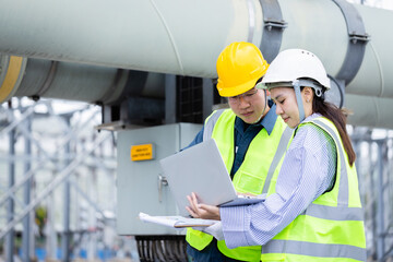 Engineer working at power substation inspection check high voltage infrastructure with safety...