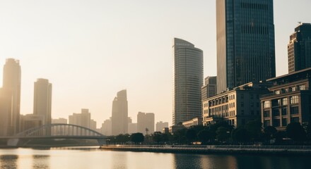 Fototapeta premium Modern skyscrapers and traditional buildings stand along creating a stunning cityscape at sunrise, with the warm glow of the sun reflecting on the calm water