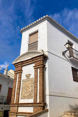 FRIGILIANA, SPAIN - MAY 10, 2025: A peaceful walk through the charming narrow streets, surrounded by whitewashed houses and colorful flowers in Frigiliana, Spain