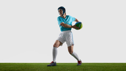 Woman rugby athlete active on field wearing sports attire and safety helmet. Concept of game moment, match intensity, fast decision and movement anticipation