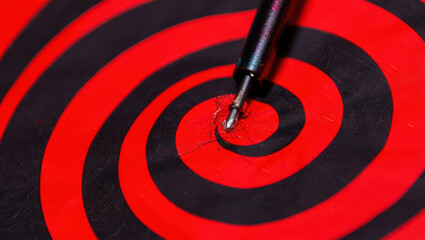 Precision Targeting A Close Up View of a Dart Hitting the Bulls Eye on a Red and Black Spiral Target Achieving Accuracy and Success in a Game of Skill and Focus