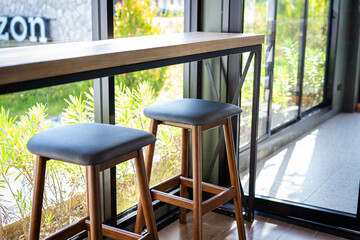 Empty wooden chair in modern coffee shop