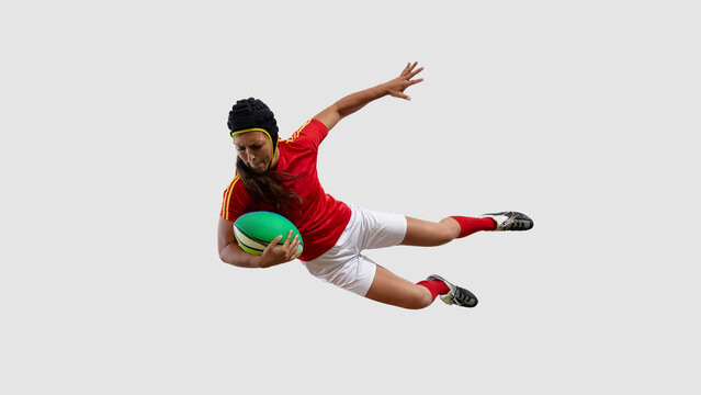 Woman wearing red rugby attire diving with green ball on white backdrop. Concept of ground dive, defensive moment, fast movement, precision leap and field performance - Powered by Adobe