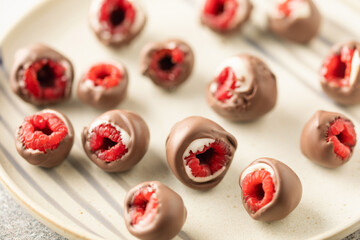 White and milk chocolate glazed raspberry candy