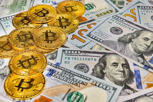 Bitcoin coins Crypto currency and paper money 100 US dollar bills , virtual currency. Finance and investment concept.
