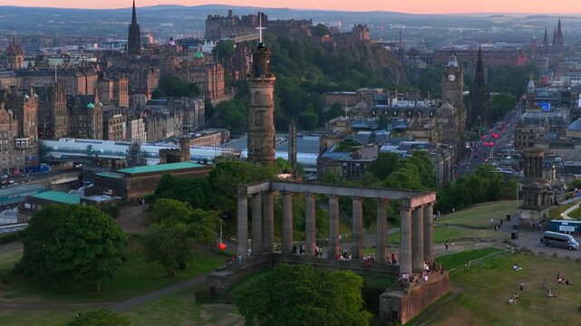 Aerial video of Edinburgh Cityscape featuring the iconic Edinburgh Castle filmed from Calton Hill at Sunset. 
