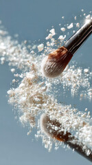 Close-up of a cosmetic makeup brush with shimmer and glitter powder floating and scattering lightly on a mirror background. Powder explosion effect.