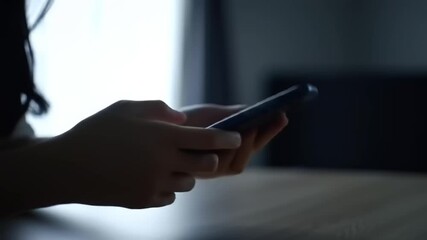 Person interacting with a smartphone while binary code overlays suggest digital connectivity - Powered by Adobe
