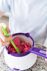 Crafting Sweet Treats: Young Chef Prepares Chocolate-Dipped Pretzels