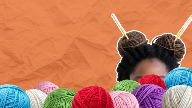 Many balls of yarn of different colors fall from above, a young woman joyfully looks out from this pile. Yarn shop concept. Empty space for text. Stop motion animation on orange paper background